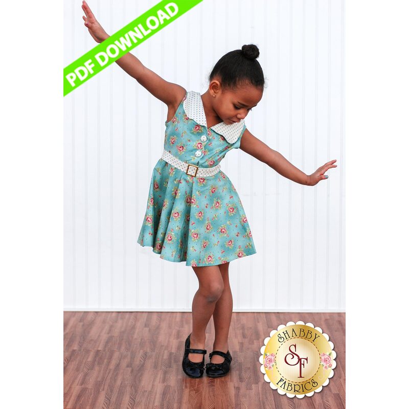The finished Charlotte dress on a dancing little girl.