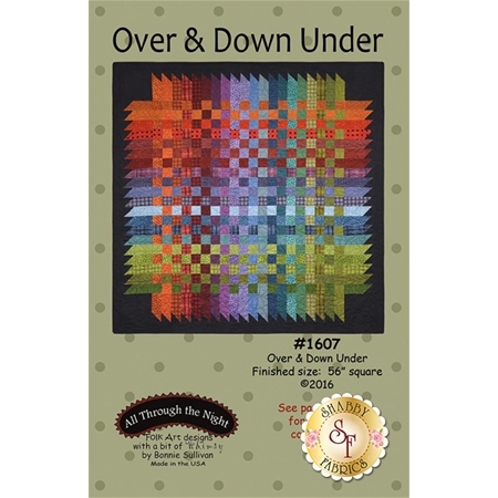 Over & Down Under Front Cover featuring a brightly colored pieced quilt with a basket weave effect