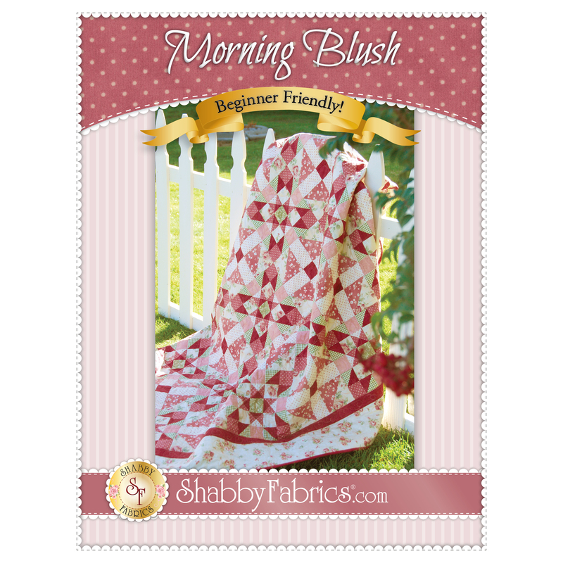 The front of the Morning Blush Quilt Pattern by Shabby Fabrics showing the finished quilt.