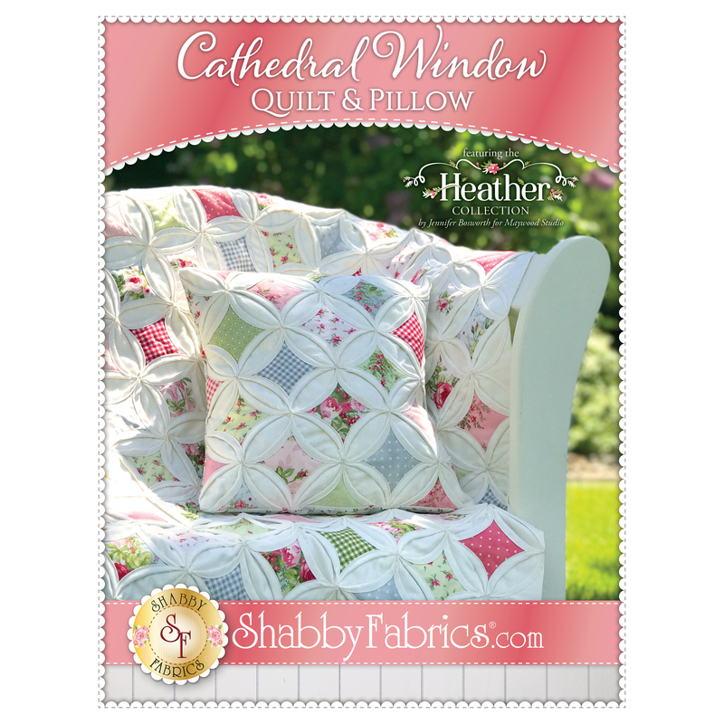The front of the Cathedral Window Quilt & Pillow pattern by Shabby Fabrics showing the finished quilt with a bonus pillow.