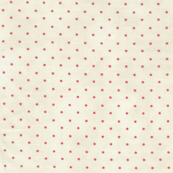 cream fabric with tiny red polka dots