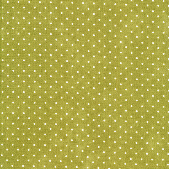 green fabric with off white polka dots