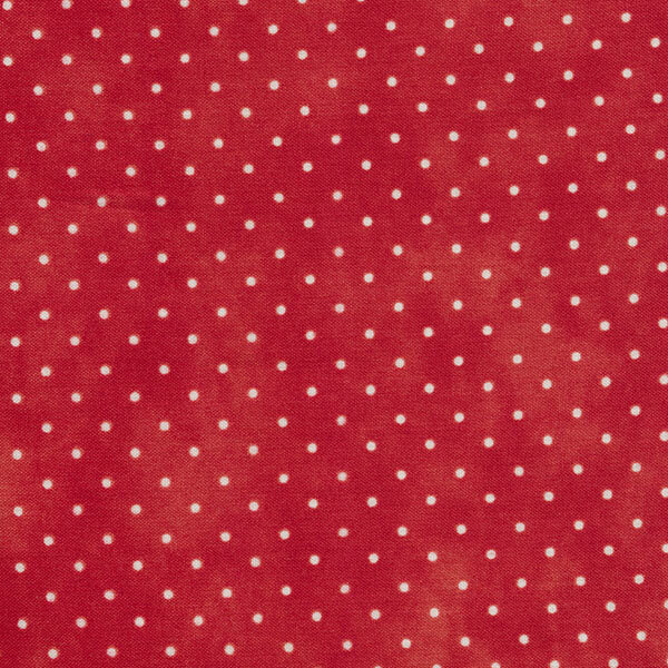 Fabric features tiny cream polka dots on mottled bright red | Shabby Fabrics