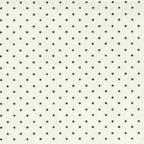 cream fabric with tiny black polka dots
