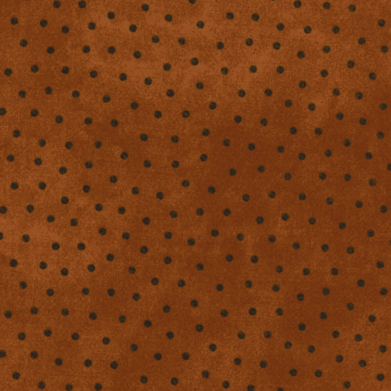 dark orange mottled flannel fabric with black polka dots
