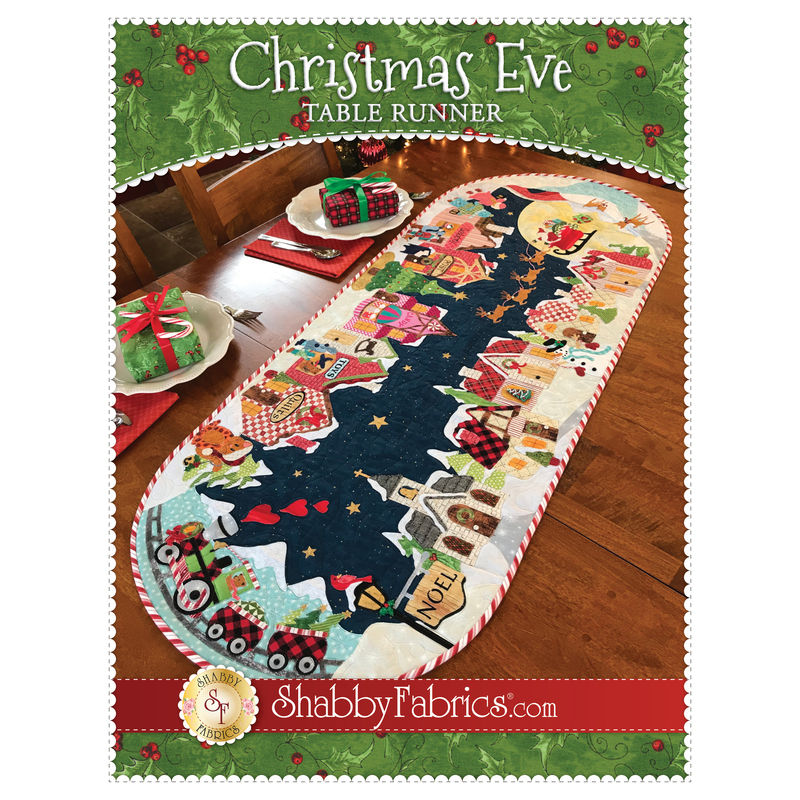 The front of the Christmas Eve Table Runner pattern by Shabby Fabrics showing the finished table runner.
