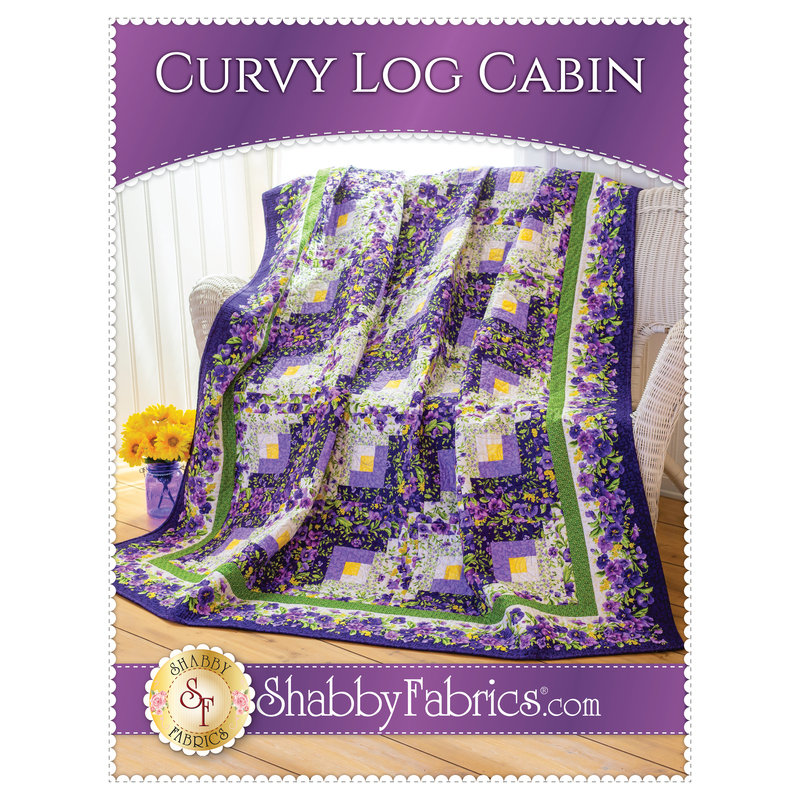 Purple, yellow, and green pieced quilt made from log cabin blocks.