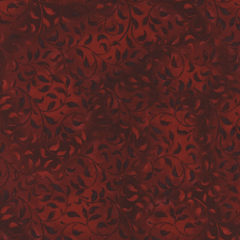 red fabric featuring a mottled leafy vine design