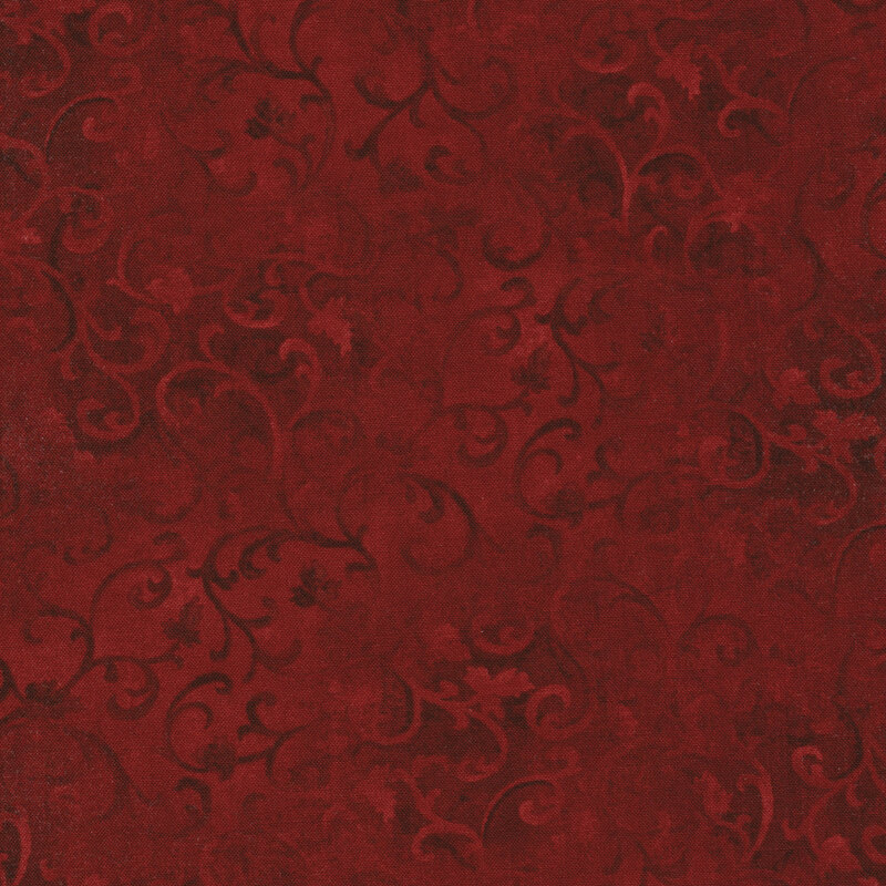 red mottled fabric with tonal swirls across it
