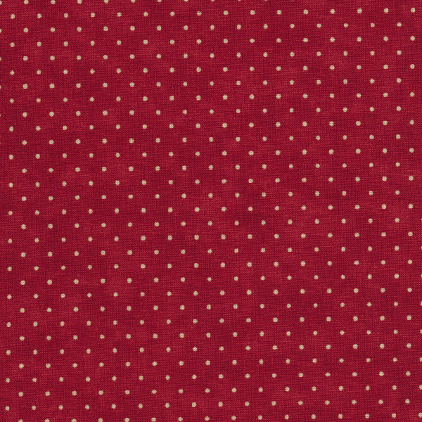 a cranberry red background with off white polka dots
