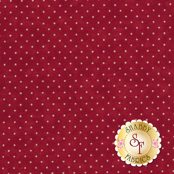 This Moda fabric features a cranberry red background with off white polka dots