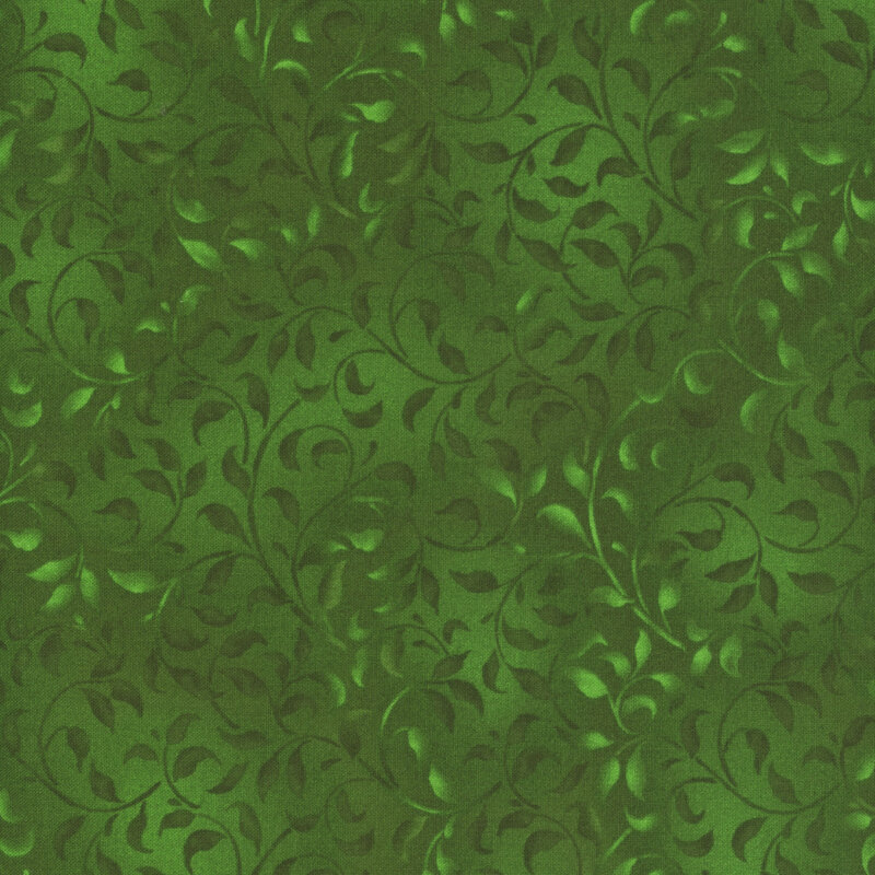 green fabric featuring a mottled leafy vine design