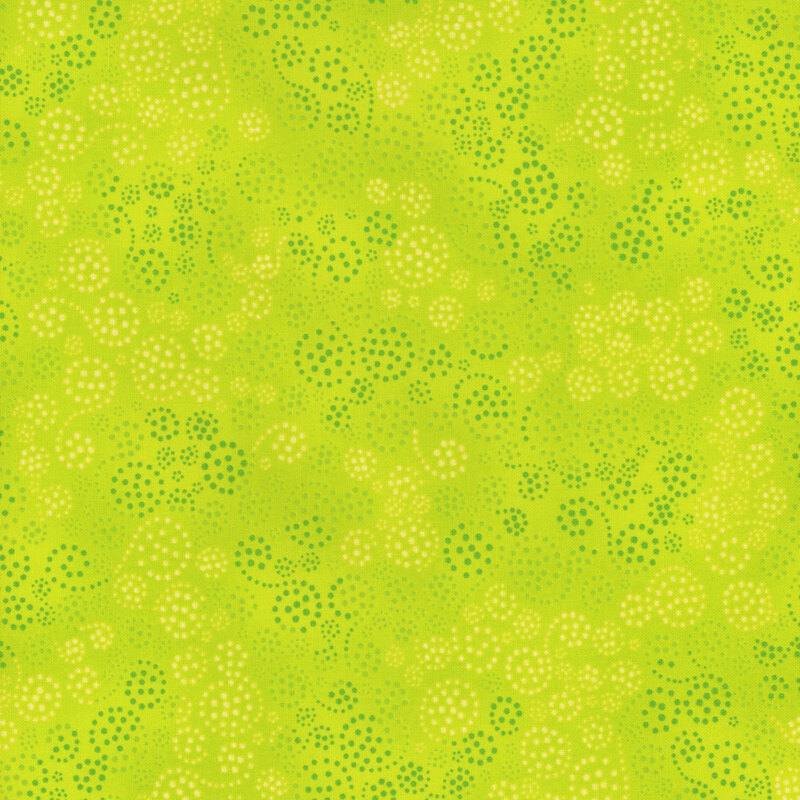 lime green fabric featuring dark green and cream dotted swirls