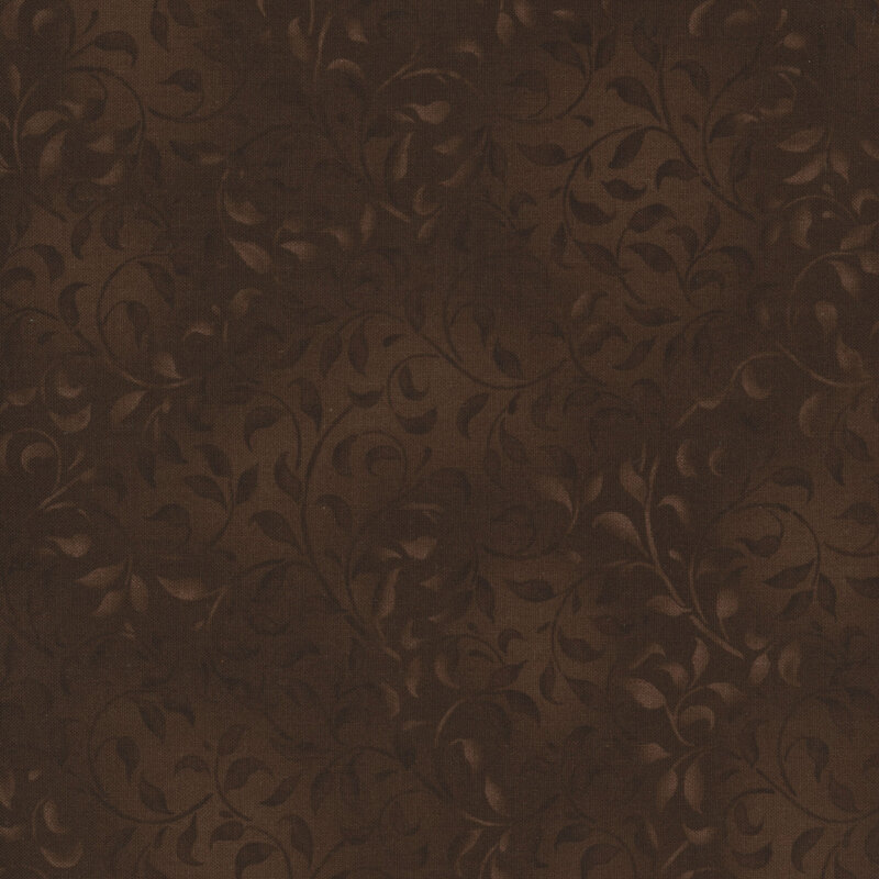 brown fabric featuring a mottled leafy vine design