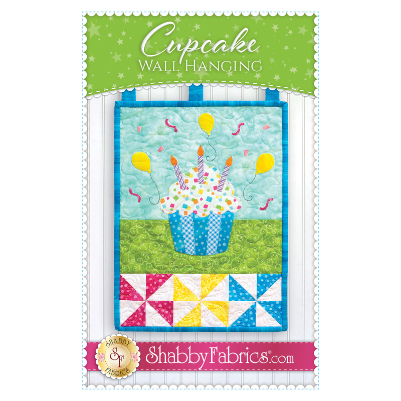 The front of the Cupcake Wall Hanging pattern by Shabby Fabrics showing the finished wall hanging.