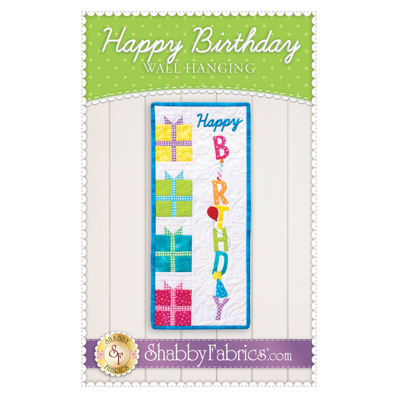 The front of the Happy Birthday Wall Hanging pattern by Shabby Fabrics showing the finished wall hanging.