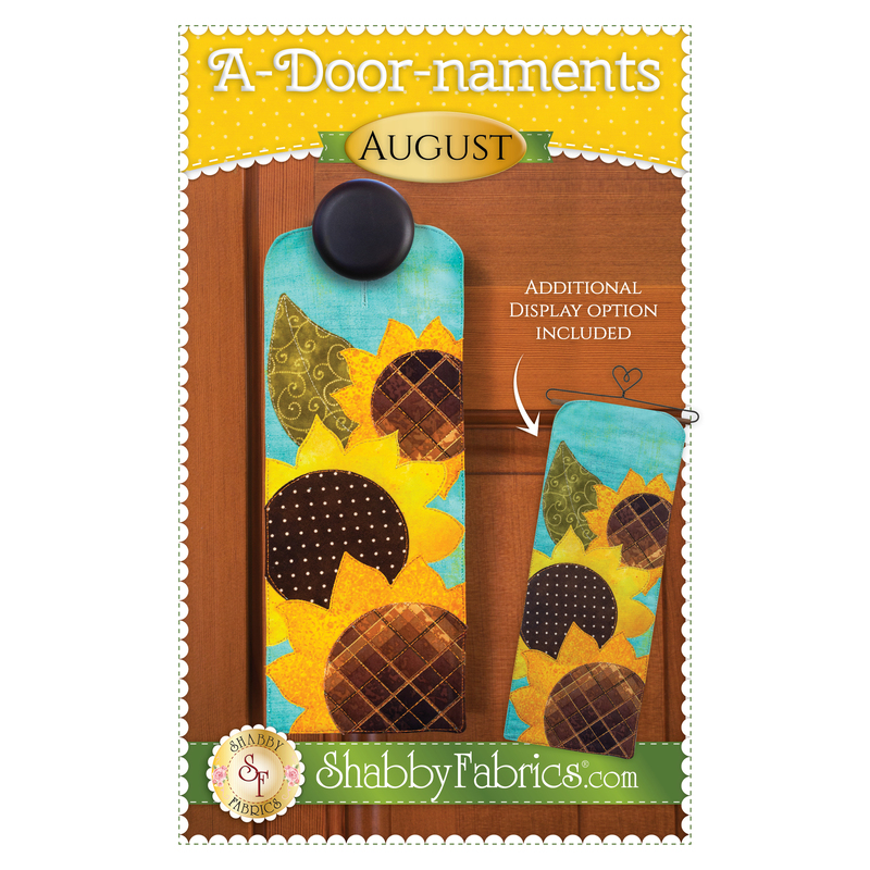 Pattern cover showing the the finished project for A-door-naments August with three yellow sunflowers on teal fabric.