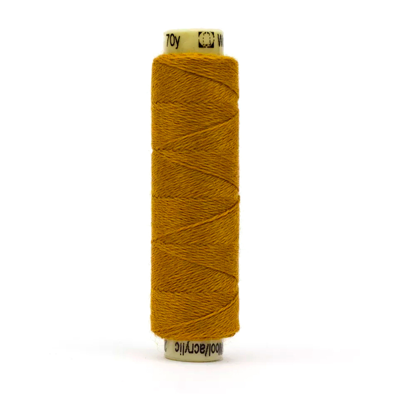 A spool of the Ellana EN35 - Old Gold thread on a white background