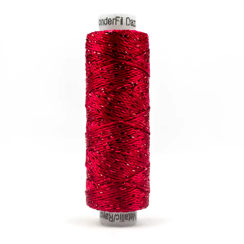 A spool of the WonderFil Dazzle 1168 - Bright Rose thread on a white background