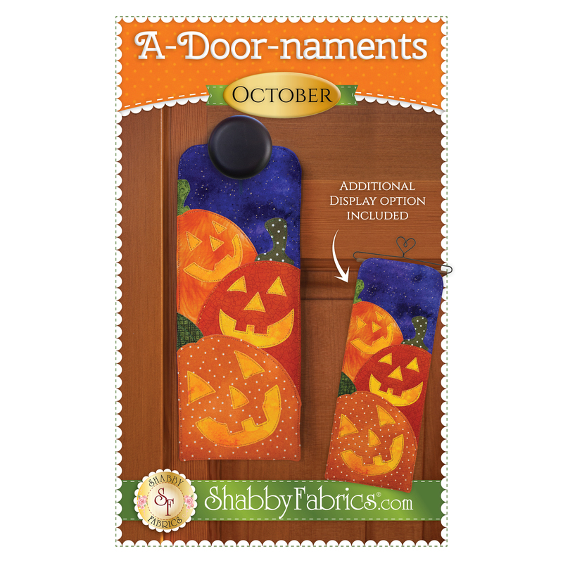 Pattern cover for A-door-naments October with three smiling jack-o-lanterns on violet fabric.