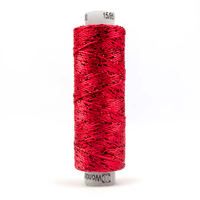 A spool of WonderFil Dazzle 1130 - Claret Red thread on a white background