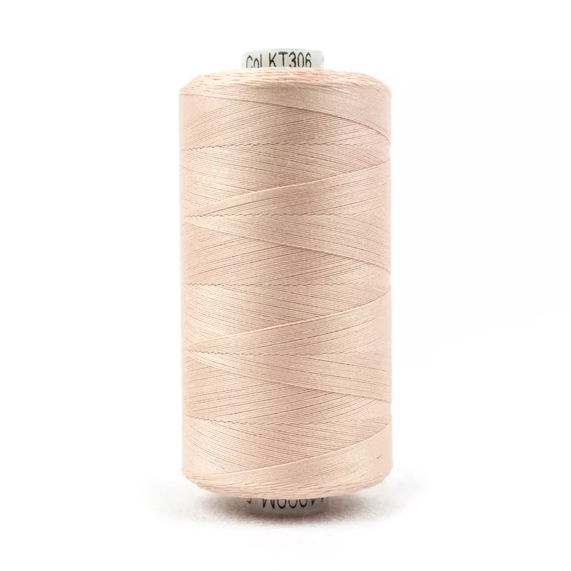 Spool of KT306 Soft Pink thread on a white background