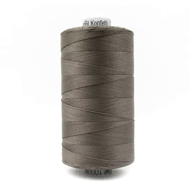 A spool of Konfetti KT804 - Brown Grey thread on a white background