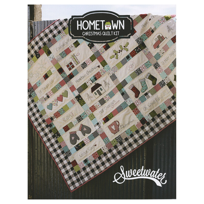 Front over of the Hometown Christmas quilt kit pattern with a photo of the finished quilt hanging over a fence