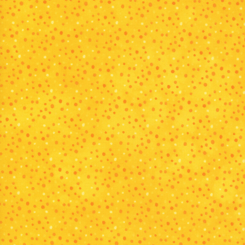 mottled yellow fabric with orange and cream dots