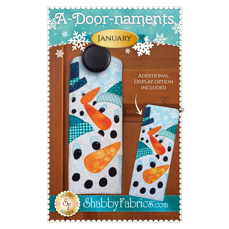 The front of the A-Door-naments - January pattern by Shabby Fabrics showing the finished project with three adorable snowmen.