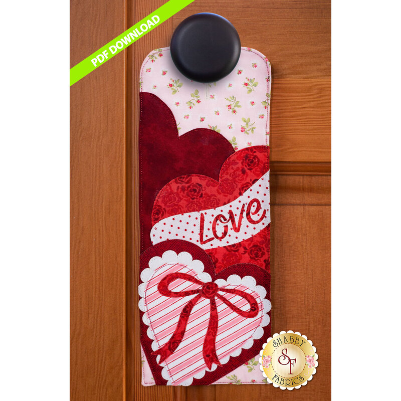 PDF Pattern for A-door-naments February with a wrapped heart-shaped box of chocolates.
