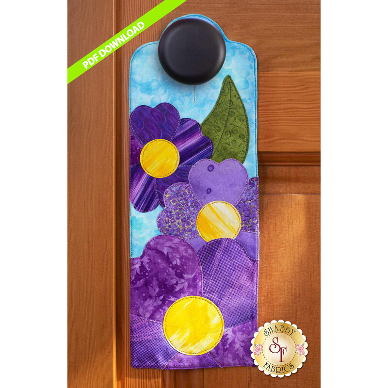 PDF Pattern for A-door-naments May with three purple pansies on blue.