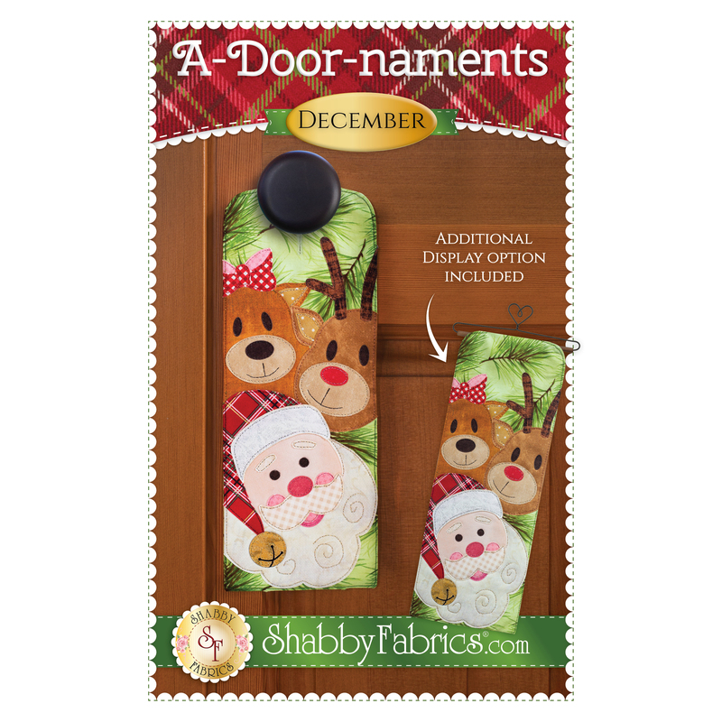 The front of the A-Door-naments - December pattern by Shabby Fabrics showing the finished door hanger with Santa, Rudolph, and a second reindeer wearing a hair bow.