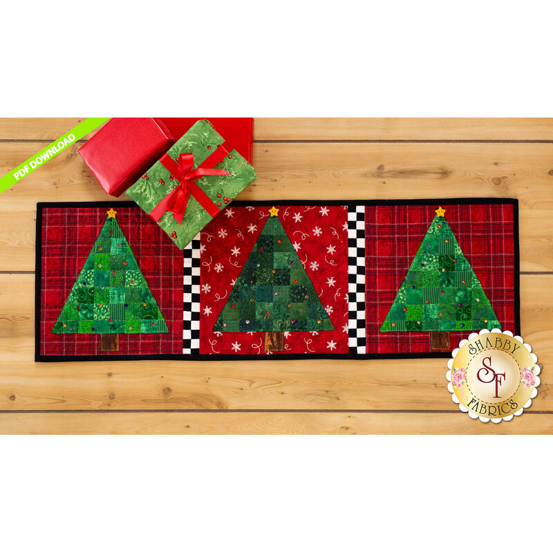 Green patchwork trees with rhinestones on red print backgrounds with checkerboard dividers.