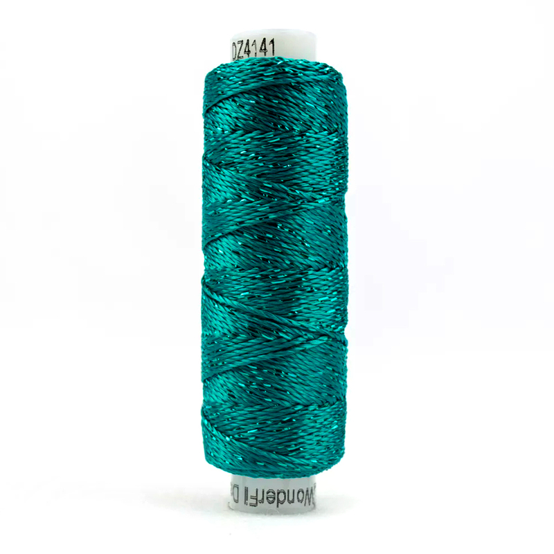 A spool of WonderFil Dazzle 4141 - Deep Peacock Blue thread on a white background