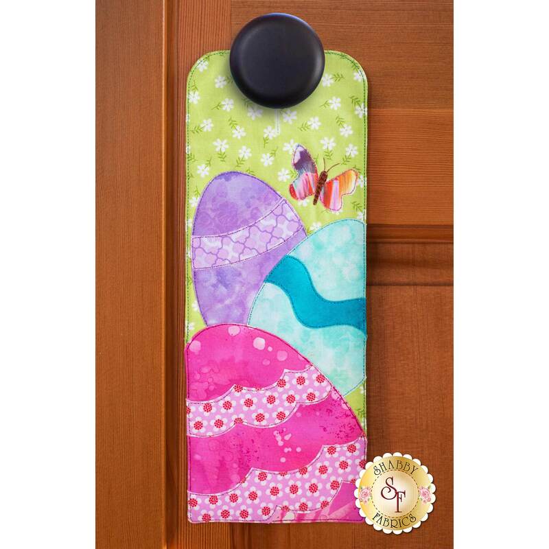 Door hanger kit for A-door-naments April with pink, blue, and purple applique egg.