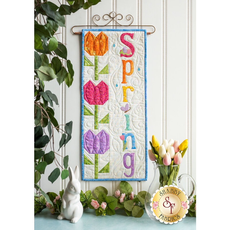 Kit for A Year In Words Wall Hangings April reading Spring with bright colored tulip blocks.