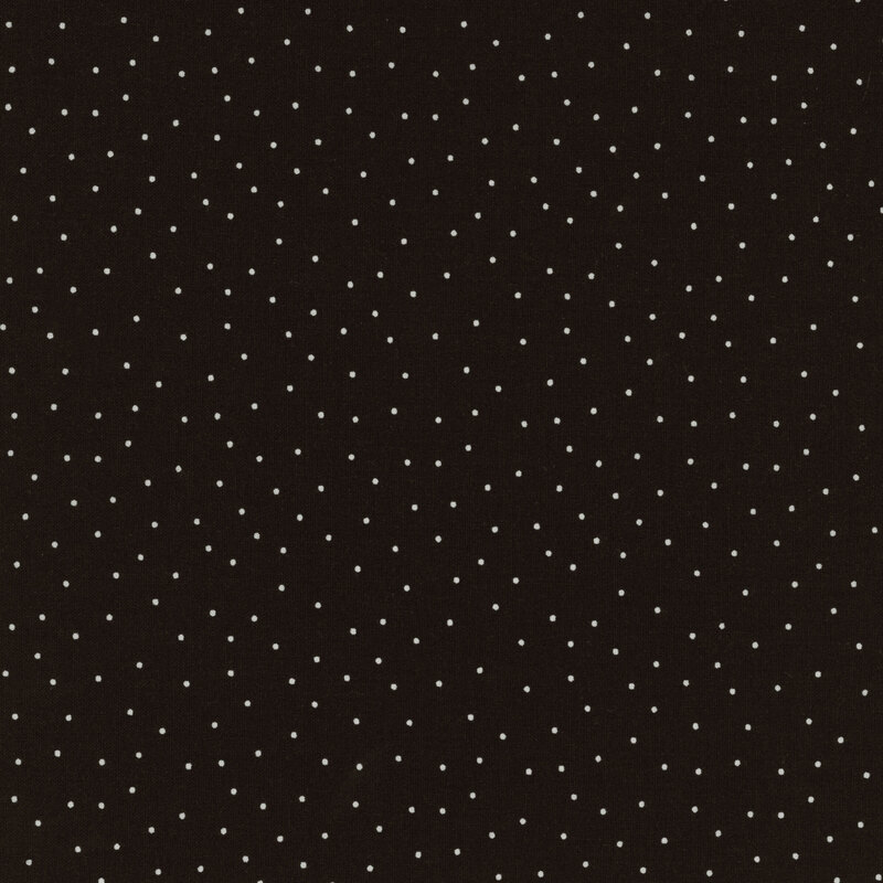 fabric featuring a solid black background with scattered small white dots