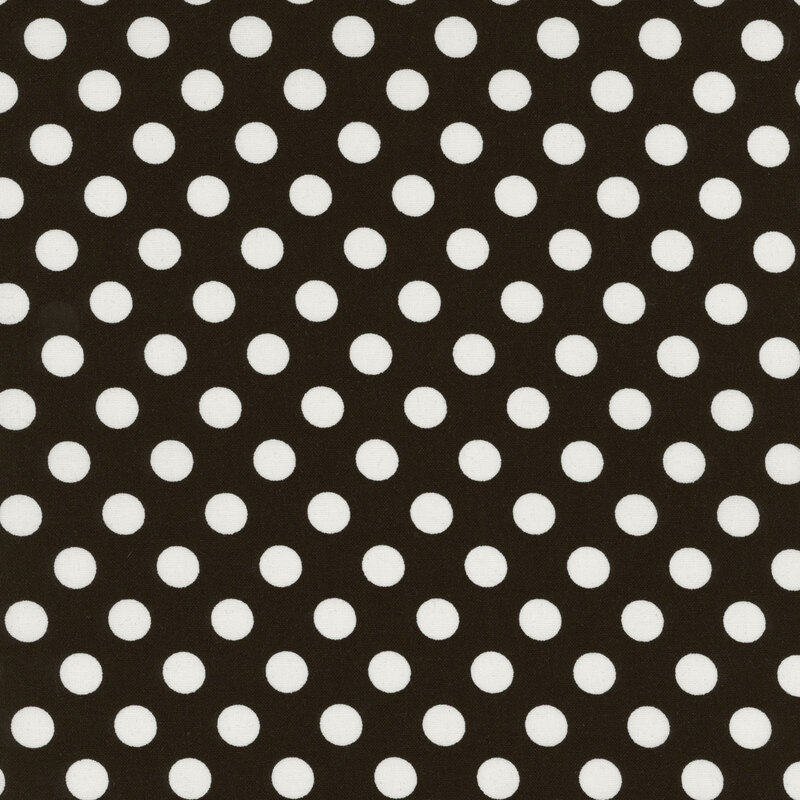fabric featuring a black background with white polka dots