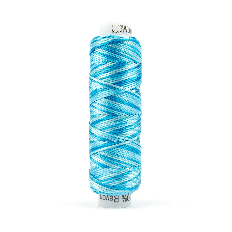 A spool of WonderFil Razzle RZM05 Little Blue Box thread on a white background