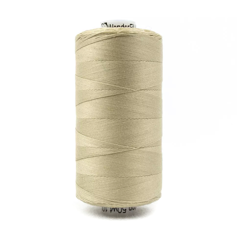 A spool of Konfetti KT807 - Tan thread on a white background