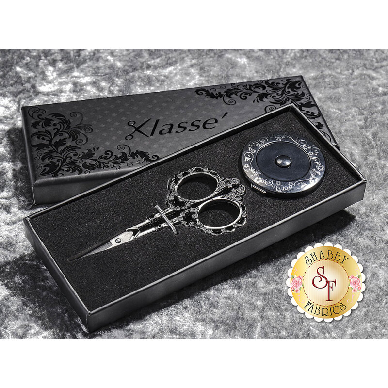 The beautiful packaging, scissors, and tape measure included in the gift set