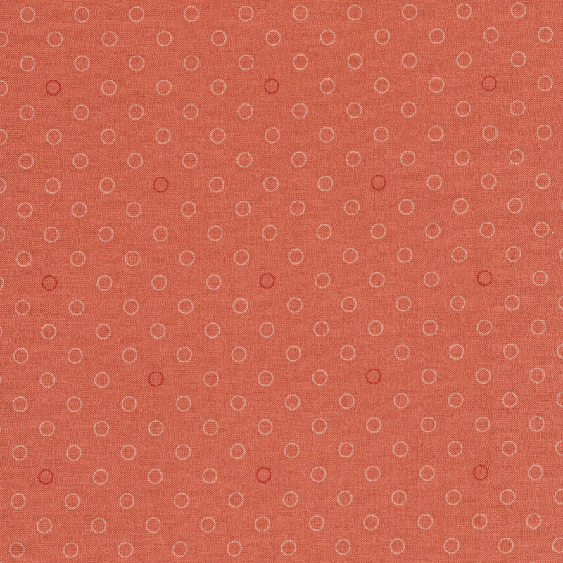 A basic coral polka dot fabric with tonal rings | Shabby Fabrics
