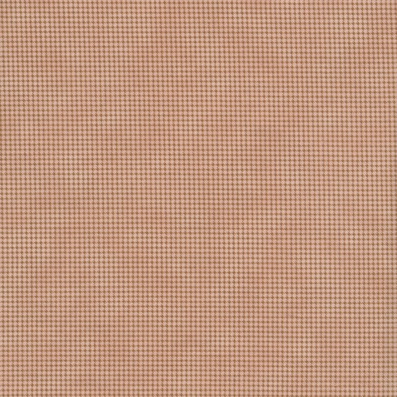 Light pink mottled fabric with dark houndstooth patterns all over