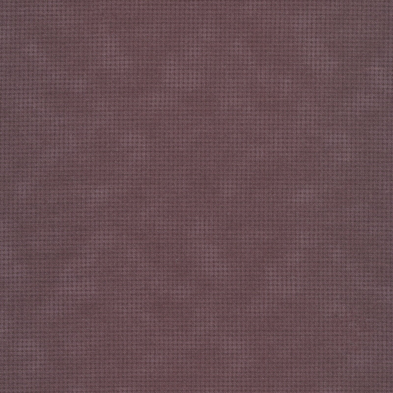 Tonal purple mottled fabric with houndstooth patterns all over