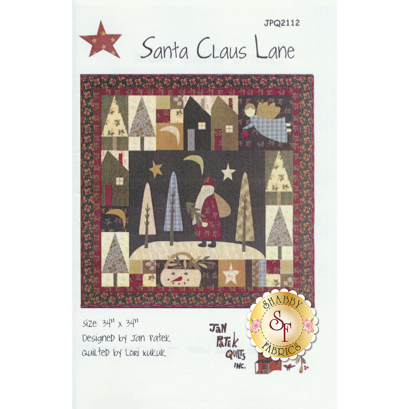 The front of the Santa Claus Lane pattern showing the finished Christmas wall hanging