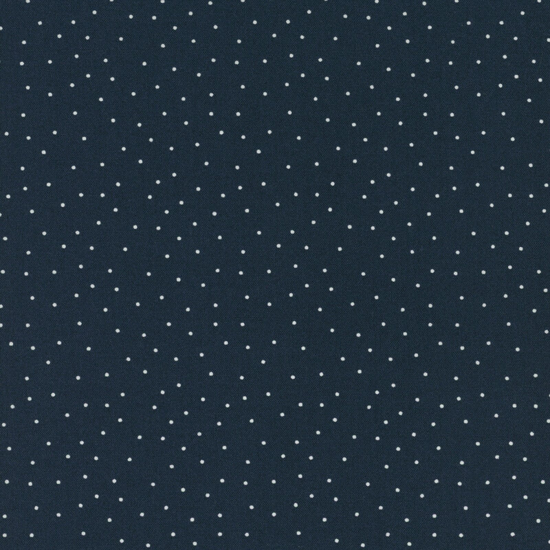 fabric features a navy blue background with scattered small white dots