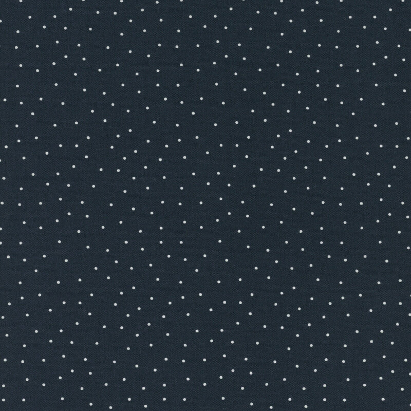 fabric features a navy blue background with scattered small white dots