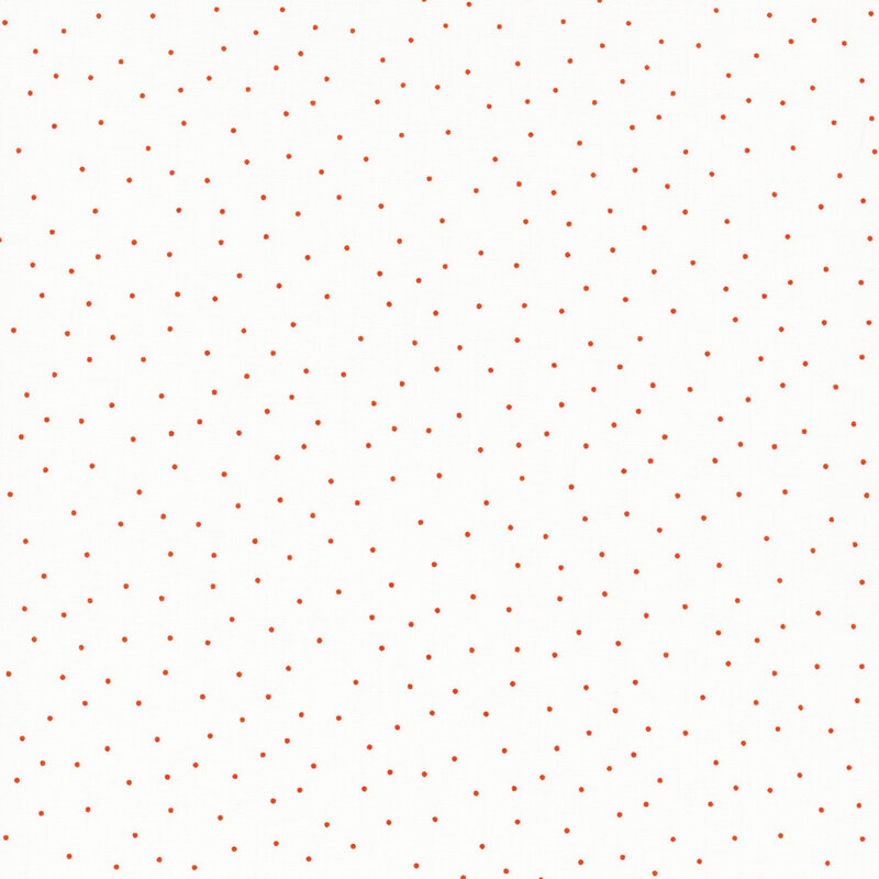 fabric featuring a white background with scattered small orange dots