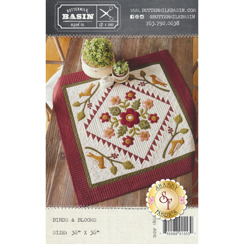 The front of the Birds & Blooms pattern showing the finished quilt full of bloomed flowers and birds in each corner.